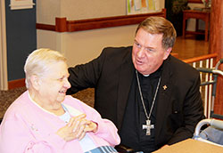 Archbishop Joseph W. Tobin visits with Providence Sister Mary Cecile Grojean on Aug. 19, 2014, at her community&rsquo;s motherhouse at Saint Mary-of-the-Woods. (Photo courtesy of the Sisters of Providence of Saint Mary-of-the-Woods)