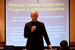 Father Tad Pacholczyk, director of education at the National Catholic Bioethics Center in Philadelphia, discusses end-of-life decisions during his Feb. 14 presentation at St. John Paul II Parish&rsquo;s St. Paul campus in Sellersburg. (Photo by Leslie Lynch)