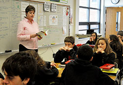 Jenny Lents, a language arts teacher at St. Louis School in Batesville, prays with her students before each class. She notes, &ldquo;I remind my students that if they put God first in everything they do, things go better.&rdquo; (Submitted photo)