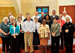 Members of the re-established Archdiocesan Pastoral Council pose after their installation at St. Bartholomew Church in Columbus on April 18. Front row: Sue Heck, left, Sara Castillo, Keith Bauer, Domoni Rouse, Mary Lee Smith and Father Joseph Moriarty. Middle row: Claudia Dominik, left, Mary Kay Wolford, Benedictine Sister Carol Falkner, Dabrice Bartet and Annette &ldquo;Mickey&rdquo; Lentz. Back row: Conventual Franciscan Father Mark Weaver, left, Larry Schremser, Bill Ward, Archbishop Joseph W. Tobin, Randy Ezell, Juan Gonz&aacute;lez and Deacon Wayne Davis. Not pictured are members Barbara Black, Paul Jannsen, Richard Steininger and Msgr. William Stumpf. (Photos by Natalie Hoefer)