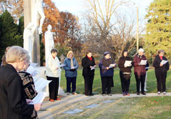 Sisters of St. Benedict at Our Lady of Grace Monastery in Beech Grove participate in an All Souls Day remembrance of their deceased sisters, on Nov. 2, 2014.&nbsp;Each year, the sisters gather at the cemetery to remember deceased sisters, and then the prioress prays over each grave.