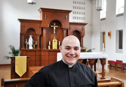 Deacon Adam Ahern is all smiles as he gives a tour through the chapel at Bishop Simon Brut&eacute; College Seminary in Indianapolis, the setting where he first had the opportunity to test his call to the priesthood. (Photo by John Shaughnessy)	