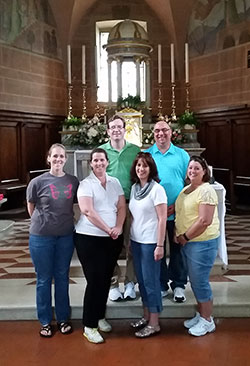 A group of educators from Roncalli High School in Indianapolis made a recent pilgrimage to Italy to learn more about their school&rsquo;s namesake, Angelo Roncalli&mdash;the birth name of St. John XXIII. Part of their trip included a visit to St. Mary&rsquo;s Church in Sotto il Monte, the church where St. John was baptized and served as an altar boy. Laura Armbruster, left, Beth Reel, Michelle Roberts and Terese Carson pose in the front row while Anthony Walters, left, and James Kedra stand in the back row. (Submitted photo by Chuck Weisenbach )