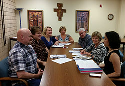 At the Archbishop Edward T. O&rsquo;Meara Catholic Center in Indianapolis on July 1, the &ldquo;Being and Belonging&rdquo; team prepares for the upcoming divorce ministry retreat on Oct. 2-4. Judy Aramount, one of the creators of the retreat, is seated second from left. (Submitted photo) 