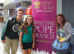 Cathedral High School students Mike Rushka, Rachel Kent and Molly Mitchell pose for a photo in Philadelphia during their recent trip to the World Meeting of Families&mdash;an experience that led them to see Pope Francis. (Submitted photo) 