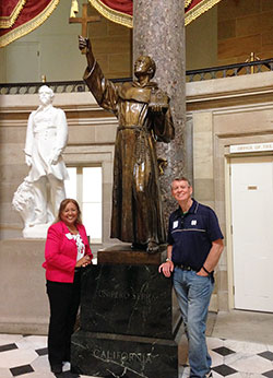 Maria Pimentel-Gannon  and her husband Jack Gannon stand in the U.S. Capitol&rsquo;s Statuary Hall next to a statue of St. Junipero Serra, who was canonized by Pope Francis on Sept. 23 in Washington.  Maria attended Pope Francis&rsquo; address to Congress on Sept. 24. (Submitted photo)