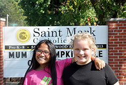 The close friendship of Kho Ti, left, and Sophie Albertson&mdash;two sixth-grade students at St. Mark School in Indianapolis&mdash;reflects the welcome that Burmese refugees have received in the past five years at St. Mark Parish and its school. (Photo by John Shaughnessy)