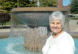 When Franciscan Sister Monica Zore was asked where she wanted to have her photo taken at Marian University in Indianapolis, the longtime math instructor chose the school&rsquo;s fountain, explaining, &ldquo;It&rsquo;s a reminder of God&rsquo;s extravagant, overflowing love. It&rsquo;s constantly pouring out, and it never runs out.&rdquo; (Photo by John Shaughnessy)