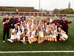Members of the girls&rsquo; soccer team at Brebeuf Jesuit Preparatory School in Indianapolis pose with the state championship trophy. They beat Penn High School in Mishawaka on Oct. 31 by a 2-1 score. (Submitted photo)