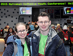 Siblings Andrea &ldquo;Andie&rdquo; and Luke Grant pose at Lucas Oil Stadium in Indianapolis on Nov. 21 after the NCYC closing Mass. The siblings, both past NCYC participants, returned this year as volunteers. (Photo by Natalie Hoefer)