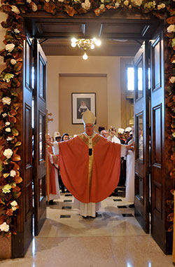 &ldquo;This is the Lord&rsquo;s gate: let us enter through it and obtain mercy and forgiveness,&rdquo; Archbishop Joseph W. Tobin declares as he opens the doors of mercy at SS. Peter and Paul Cathedral in Indianapolis on Dec. 13. (Photo by Natalie Hoefer)