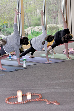 Women hold a position through the recitation of a Hail Mary while doing SoulCore&mdash;a rosary-based, core-strengthening exercise&mdash;at Our Lady of Fatima Retreat House in Indianapolis on April 29, 2015. (Criterion file photo by Natalie Hoefer)