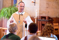 Benedictine Archabbot Justin DuVall delivers a homily during a July 11, 2013, Mass in the St. Thomas Aquinas Chapel at Saint Meinrad Seminary and School of Theology in St. Meinrad during the seminary&rsquo;s One Bread One Cup youth liturgical formation program. The leader of Saint Meinrad Archabbey in St. Meinrad, Archabbot Justin announced on Jan. 13 that he would resign effective on June 2. (Photo courtesy of Saint Meinrad Archabbey)