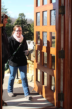 Alan Mathews, left, and Samantha Strom walk through the holy door at the Archabbey Church of Our Lady of Einsiedeln in St. Meinrad on Jan. 18. Mathews and Strom are faculty members of Our Lady of Providence Jr./Sr. High School in Clarksville who respectively teach Spanish and science. Providence&rsquo;s faculty and staff went on a retreat focused on the Holy Year of Mercy at Saint Meinrad Archabbey. (Submitted photo) 