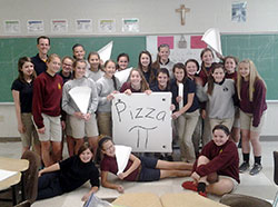 A team of teachers at St. Barnabas School in Indianapolis has been chosen for a special three-year program at the University of Notre Dame that focuses on helping teachers inspire student learning in the areas of science, technology, engineering and math (STEM). Here, math teacher Doug Bauman poses with his students after they worked to create new pizza boxes&mdash;a challenge that Bauman made after he ordered an extra-large pizza that was placed in a box that wouldn&rsquo;t fit in his car. (Submitted photo)