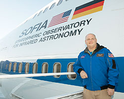 Troy Cockrum poses for a photo near a NASA jetliner in November of 2015. The director of innovative teaching at St. Therese of the Infant Jesus (Little Flower) School in Indianapolis, Cockrum was one of 28 educators from across the country who was chosen to fly on NASA&rsquo;s Stratospheric Observatory for Infrared Astronomy (SOFIA), the world&rsquo;s largest flying telescope. (Submitted photo)