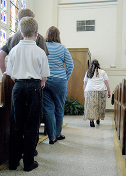 People wait in line outside of a confessional in Our Lady of the Most Holy Rosary Church in Indianapolis. The importance of the sacrament of penance in the life of faith is being emphasized in the Archdiocese of Indianapolis during the Holy Year of Mercy. Some archdiocesan parishes are making the celebration of the sacrament more widely available during &ldquo;24 Hours for the Lord&rdquo; on March 4-5. (File photo by Sean Gallagher)