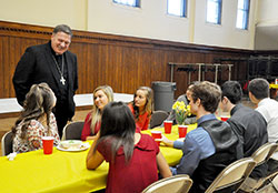 Archbishop Joseph W. Tobin chats with a few &ldquo;A Promise to Keep&rdquo; mentors from Roncalli High School during a luncheon at the Archbishop Edward T. O&rsquo;Meara Catholic Center in Indianapolis on April 14. (Photos by Natalie Hoefer)