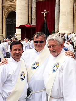 Archdiocesan deacons Ron Pirau, left, Brad Anderson and Michael East pose for a photo in St. Peter&rsquo;s Square at the Vatican following the Mass for the Jubilee of Deacons that Pope Francis celebrated on May 29. (Submitted photo)