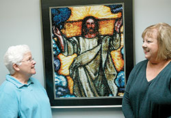 Phyllis McNamara, left, has led a Catholic prayer program called Oremus at Christ the King Parish in Indianapolis&mdash;a program designed to help people develop a closer relationship with God. Here, she talks with Cindy Flaten, director of religious education at the parish. (Photo by John Shaughnessy)