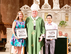 Archbishop Joseph W. Tobin poses for a photo with Brie Anne Eichhorn and Cory Watkins, the recipients of the archdiocese&rsquo;s 2016 Young Adult Servant Leader of the Year Award. The awards were presented during a Mass at SS. Peter and Paul Cathedral in Indianapolis on Sept. 25. (Submitted photo by Allie Tyler)