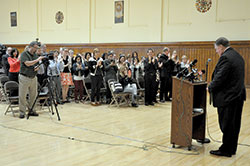 Cardinal-designate Joseph W. Tobin receives a standing ovation from archdiocesan staff at the Archbishop Edward T. O&rsquo;Meara Catholic Center in Indianapolis on Oct. 10 at the beginning of a press conference. During the gathering, which included members of the secular media, Cardinal-designate Tobin discussed being named a cardinal the day before by Pope Francis. (Photo by Sean Gallagher )