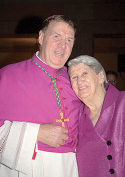 Cardinal-designate Joseph W. Tobin poses with his mother, Marie Tobin, on Oct. 9, 2010, after he was ordained an archbishop at St. Peter&rsquo;s Basilica at the Vatican. (Criterion file photo)