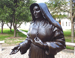 A statue of St. Mother Theodore Gu&eacute;rin graces the courtyard of the Sisters of Providence of St. Mary-of-the-Woods, Ind. on Oct. 6. The sisters celebrated the 10th anniversary of their congregation&rsquo;s foundress on Oct. 15. (CNS photos/Katie Breidenbach)