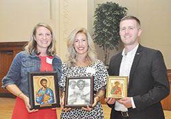 Brie Anne Eichhorn, left, Dr. Casey Reising and Elliott Bedford pose with the awards they received at the Catholic Medical Association reception held at the Archbishop Edward T. O&rsquo;Meara Catholic Center after the White Mass on Sept. 29. (Photos by Natalie Hoefer)