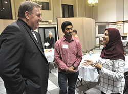 Cardinal-designate Joseph W. Tobin, archbishop of Indianapolis, speaks with Rabia Khan, information technology coordinator for the Plainfield-based Islamic Society of North America, and her son Uzair Khan after a Catholic-Muslim panel discussion on Oct.&nbsp;19 at Sacred Heart of Jesus Parish in Indianapolis. (Photo by Sean Gallagher)