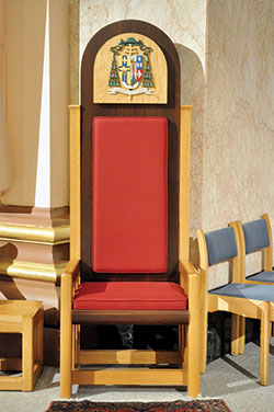 The cathedra, the ceremonial seat of the archbishop of Indianapolis, sits empty in SS. Peter and Paul Cathedral in Indianapolis on Nov. 8, the day after Cardinal-designate Joseph W. Tobin was announced as the new archbishop of Newark, N.J. While the cathedra will remain unused until the appointment of a new archbishop of Indianapolis, the Church&rsquo;s Code of Canon Law provides for the steady day-to-day governance of the Church in central and southern Indiana in the interim. (Photo by Sean Gallagher)