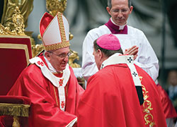 Pope Francis greets Archbishop Joseph W. Tobin of Indianapolis after presenting him with a pallium during a Mass marking the feast of Sts. Peter and Paul in St. Peter&rsquo;s Basilica at the Vatican on June 29, 2013. (CNS photo/Alessia Giuliani, Catholic Press Photo)