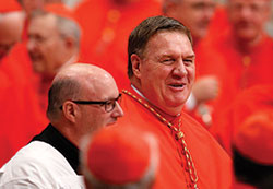 Cardinal-designate Joseph W. Tobin arrives for the consistory in St. Peter&rsquo;s Basilica at the Vatican on Nov. 19. Also shown is Msgr. William F. Stumpf, archdiocesan moderator of the curia. Cardinal Tobin was among 17 new cardinals created by Pope Francis at the consistory. (CNS photo/Paul Haring) 
