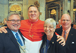 Greg Otolski, left, archdiocesan director of communications; Cardinal Joseph W. Tobin; Theresa Brydon, executive assistant to the cardinal; and Loral Tansy, who has assisted Cardinal Tobin as master of ceremonies during liturgies in the archdiocese, are pictured in St. Peter&rsquo;s Basilica at the Vatican on Nov. 19.