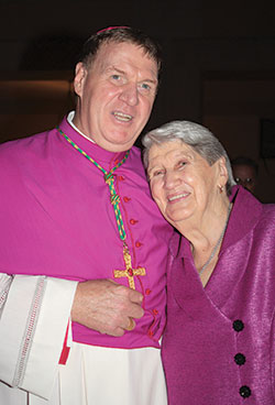 Archbishop Joseph W. Tobin poses with his mother, Marie Tobin, on Oct. 9, 2010, after he was ordained an archbishop at St. Peter&rsquo;s Basilica at the Vatican. (Criterion file photo)