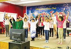Children from the archdiocesan Vietnamese Catholic Congregation take the stage on Nov. 27 in Elford Hall at St. Joseph Parish in Indianapolis. The performance was part of the west side parish&rsquo; s commemoration of the Feast of the Holy Vietnamese Martyrs. (Photo by Victoria Arthur) 