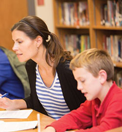 Emily Denton strives to give her students at St. Thomas Aquinas School in Indianapolis &ldquo;a sense that we&rsquo;re all on this journey together, and we are here to care for each other.&rdquo; Here, she works alongside Owen DeLaney. (Submitted photo)