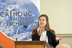 Heidi Smith, director of Catholic Charities Indianapolis&rsquo; Refugee and Immigrant Services, talks on Feb. 17 to nearly 70 members of the Catholic Business Exchange on the lives of refugees, the history of refugee resettlement in the United States, and the role of the Church in refugee resettlement in Indianapolis. (Photo by Natalie Hoefer)