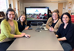 Part of the team responsible for the Blue Roots project show off their Watershed website on March 2. From left, staff member Faith Kellermeyer, students Aiste&middot; Manfredini and Briee Eikenberry, and advisor Dr. Jennifer Palilonis. (Photo by Katie Breidenbach)