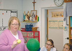 Her inquisitive nature&mdash;and her deep belief in the beautiful design of the world that God has created&mdash;serve Leah Massingale well as she teaches science to middle-school students at St. Michael School in Greenfield. (Photo by John Shaughnessy) 