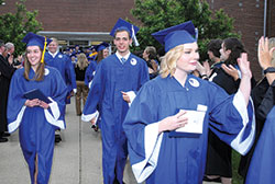 Emma O&rsquo;Brien, left, Nick Rivelli and Shelby Robertson are all smiles after the graduation ceremony at Bishop Chatard High School in Indianapolis on May 20, 2016. (Photo courtesy of Tiffany Photography Studio)