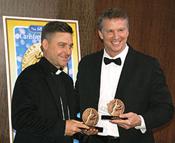 Dr. Chuck Dietzen is pictured with Father Jonathan Morris of The Christophers on May 16 in New York. Dietzen received the organization&rsquo;s James Keller award, and a Christopher Award for his recent book, Pint-Sized Prophets: Inspirational Moments That Taught Me We Are All Born to Be Healers. He is the first person to receive two awards from the organization in the same year. (Submitted photo by Charles Schisla)