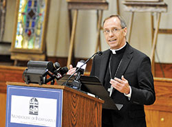 Archbishop-designate Charles C. Thompson speaks during a press conference on June 13 at the Archbishop Edward T. O&rsquo;Meara Catholic Center in Indianapolis. Earlier in the day Pope Francis had named the Evansville bishop as the seventh archbishop of Indianapolis, succeeding Cardinal Joseph W. Tobin, who was appointed to lead the Archdiocese of Newark, N.J., last November. (Photo by Sean Gallagher)