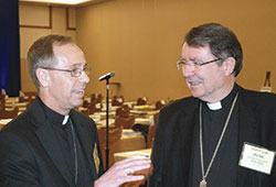 Archbishop&ndash;designate Charles C. Thompson of Indianapolis talks with Archbishop&nbsp;Christophe Pierre, apostolic nuncio to the United States, during a break at the spring meeting of the U.S. Conference of Catholic Bishops in Indianapolis on&nbsp;June 14. (Photo by John Shaughnessy)