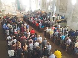 A congregation of about 300, including 136 youths of the New Albany Deanery bound for the National Catholic Youth Conference (NCYC) in Indianapolis in November, worship during a special Mass at St.&nbsp;Augustine Church in Jeffersonville on Aug. 13. Following the Mass, they attended a breakfast hosted by Knights of Columbus Council 1348, who donated $100 to each of the youths to help them attend NCYC. (Submitted photo)