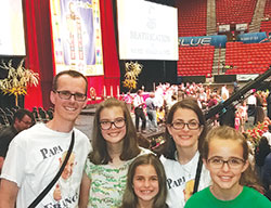 Doug Bauman, left, and his wife, Julie, second from right, are pictured with their daughters Annie, second from left, Betsy and Lily before the Sept. 23 beatification Mass for Father&nbsp;Stanley Rother in the Cox Convention Center in Oklahoma City, Okla. (Submitted photo)