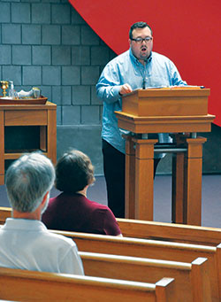 Kile Stevens, a member of St. Joseph Parish in Shelbyville, leads the congregation in the responsorial psalm at St.&nbsp;Thomas Aquinas Church in Indianapolis on Sept. 24 during a special Mass for those affected by mental illness. (Photo by Natalie Hoefer)