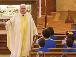 As pastor of St. Roch Parish in Indianapolis, Father James Wilmoth has always had a close connection with the students at the parish school&mdash;a connection that led to the students raising more than $26,000 earlier this year to help a Catholic school in Texas devastated by Hurricane Harvey in August of 2017. (Submitted photo)