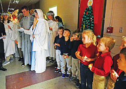 Students of St. Bartholomew School in Columbus participate in a Las Posadas procession on Dec. 18, 2017. The procession is a traditional Mexican Advent celebration that re-enacts Mary&rsquo;s and Joseph&rsquo;s search for a room in Bethlehem, and commemorates the nine months during which Mary carried Jesus in her womb. The procession is just one way in which the school, a member of the archdiocese&rsquo;s new Latino Outreach Initiative, is seeking to invite and support their Latino students and families. (Submitted photo)