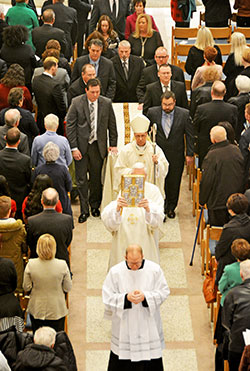 Indianapolis Archbishop Charles C.&nbsp;Thompson processes in front of the casket of Archbishop Emeritus Daniel M. Buechlein, former shepherd of the Church in central and southern Indiana, at the end of his Jan. 31 funeral Mass at SS.&nbsp;Peter and Paul Cathedral in Indianapolis. Archbishop Buechlein died on Jan. 25 at age&nbsp;79. (Photo by Natalie Hoefer)